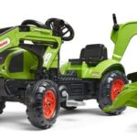 Retroexcavadora Claas con cargador frontal y remolque